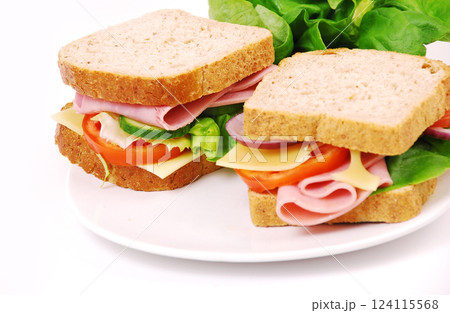 Healthy ham sandwich with cheese, tomatoes on white background 124115568