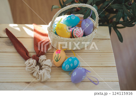 easter holiday concept with colorful egg and put in basket and put on wood table easter holiday concept with colorful egg and put in basket and put on wood table 124115916