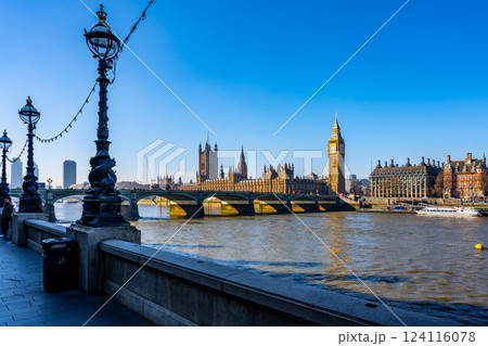 The stunning skyline showcases Big Ben and the Houses of Parliament, beautifully lit against a clear blue sky, with Westminster Bridge framing the scene across the River Thames. The stunning skyline showcases Big Ben and the Houses of Parliament, beautifully lit against a clear blue sky, with Westminster Bridge framing the scene across the River Thames. 124116078