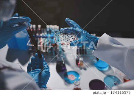 Researchers working in the clinical laboratory Researchers working in the clinical laboratory 124116575