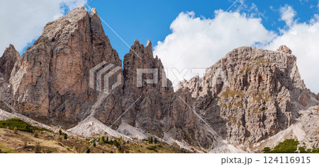Majestic mountain range with rocky peaks and blue sky near Valley of Funes at Dolomites, Italy 124116915