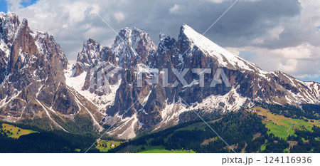 Stunning alpine mountain range panorama with snow-capped peaks near Valley of Funes at Dolomites, Italy Stunning alpine mountain range panorama with snow-capped peaks near Valley of Funes at Dolomites, Italy 124116936