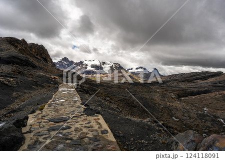 Stone trail leading to Pastoruri Glacier, Huaraz, Peru, amidst rugged mountains Stone trail leading to Pastoruri Glacier, Huaraz, Peru, amidst rugged mountains 124118091