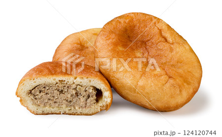 Meat pies and half on a white background. Isolated 124120744
