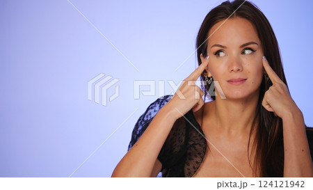 Woman practicing facial yoga for youthful skin Woman practicing facial yoga for youthful skin 124121942