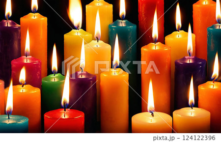 Close-up of bright multicolored burning candles in the dark Close-up of bright multicolored burning candles in the dark 124122396
