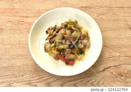 spicy stir fried ostrich meat with onion and black pepper on plate  124122764