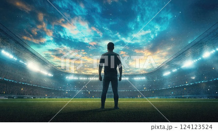 A lone figure stands in silhouette on a floodlit soccer field, facing a massive stadium filled with spectators under a dramatic twilight sky with stadium lights illuminating the scene 124123524
