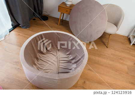 Modern Beige Velvet Round Folding Chair with Removable Cushion in Stylish Minimalist Interior Modern Beige Velvet Round Folding Chair with Removable Cushion in Stylish Minimalist Interior 124123916