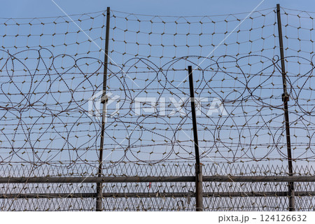 Barbwire at the DMZ Korean Demilitarized Zone that separates North and South Korea in Paju, South Korea 124126632