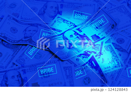 Bribe background. American Dollar in ultraviolet light 124128843