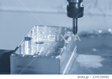 The CNC milling machine chamfer cutting aluminum housing part by chamfer tool in the light blue scene. 124130092