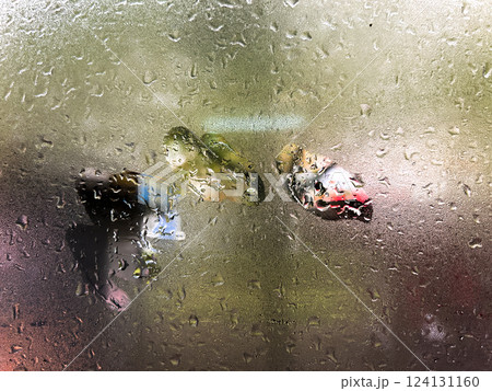 Wet window during rain. Window with raindrops. Wet surface. Background with copy space. 124131160