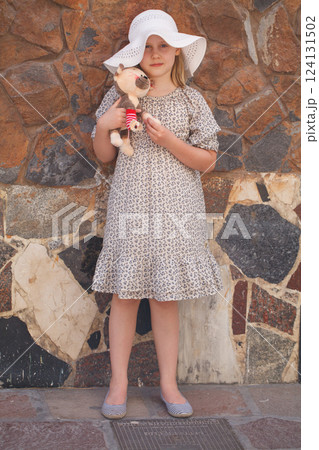 Happy child looking at camera outdoors Happy child looking at camera outdoors 124131502