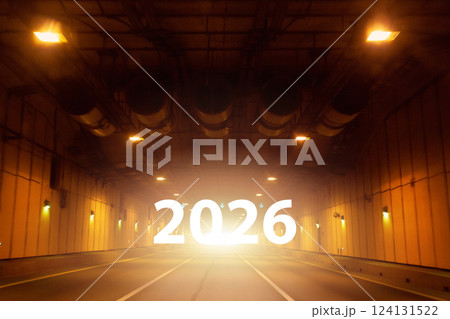 Empty long tunnel with yellow lamps on walls 124131522