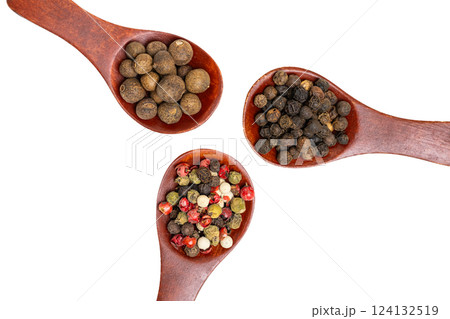 different spices in a wooden spoon 124132519