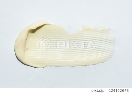 Close-up smear of mayonnaise sauce on white background, top view. Close-up smear of mayonnaise sauce on white background, top view. 124132678