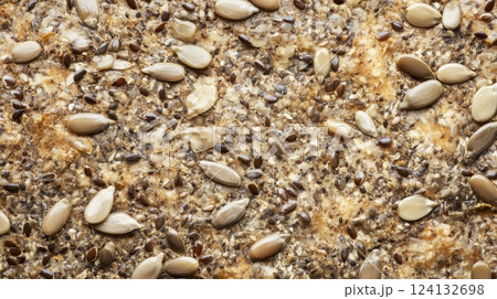 crispy crackers with sunflower and flax seeds, golden-brown and textured, highlighting rustic homemade quality and natural ingredients concept of healthy snacks, organic food, artisanal baking 124132698