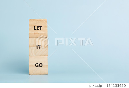 Wooden cubes with inscriptions Let It Go on a blue background 124133420
