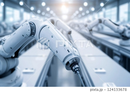 Robotic arms working on assembly line in modern factory 124133678