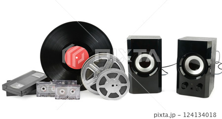 A new black bookshelf speaker, Film strip, films and videotapes isolated on white background. Collage. A new black bookshelf speaker, Film strip, films and videotapes isolated on white background. Collage. 124134018