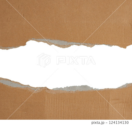 Torn edges of brown paper on a white background, space for writing. Copy space 124134130