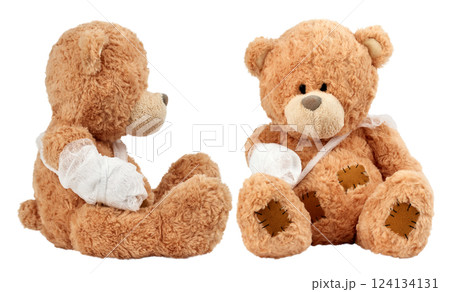 Soft brown teddy bears sitting with bandaged arms and visible stitched patches, symbolizing care, recovery, and support. Soft brown teddy bears sitting with bandaged arms and visible stitched patches, symbolizing care, recovery, and support. 124134131