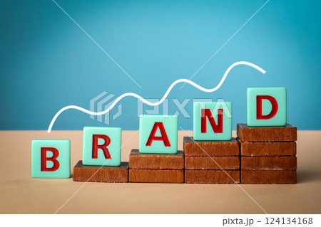 Brand. Alphabet blocks on wooden blocks. Light background Brand. Alphabet blocks on wooden blocks. Light background 124134168