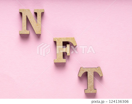 Non-Fungible Token on Pink Background, Minimalistic Crypto Art Concept, Top View 124136306