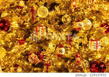 Christmas tree with glass balls, bird, red icicles. 124137472