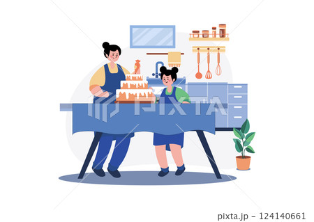 Mother and daughter making cake together 124140661