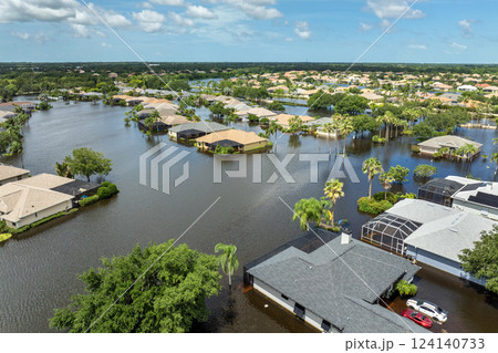 Hurricane Debby tropical rainstorm flooded residential homes and cars in suburban community in Sarasota, Florida. Aftermath of natural disaster 124140733