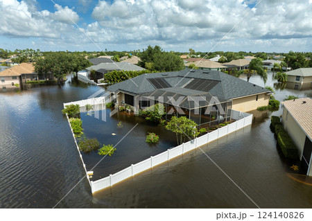 Flooding in Florida caused by tropical storm from hurricane Debby. Suburb houses in Laurel Meadows residential community surrounded by flood waters in Sarasota. Aftermath of natural disaster Flooding in Florida caused by tropical storm from hurricane Debby. Suburb houses in Laurel Meadows residential community surrounded by flood waters in Sarasota. Aftermath of natural disaster 124140826