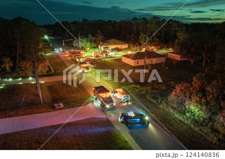First responders investigating fire hazard of private house. Emergency service personnel responding to carbon monoxide accident on Florida residential street 124140836
