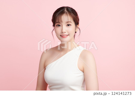 A beautiful young Asian woman with clean, fresh skin against a pink background. Skincare, facial treatment, cosmetology, beauty, and spa. An elegant portrait of an Asian woman. A beautiful young Asian woman with clean, fresh skin against a pink background. Skincare, facial treatment, cosmetology, beauty, and spa. An elegant portrait of an Asian woman. 124141273