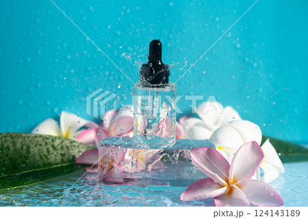 Moisturizing serum cools on ice, capturing water spills and enhancing plumeria beauty. Moisturizing serum cools on ice, capturing water spills and enhancing plumeria beauty. 124143189
