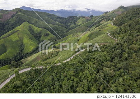 Landscape of Morning Mist with Mountain Layer. mountain ridge and clouds in rural jungle bush forest 124143330