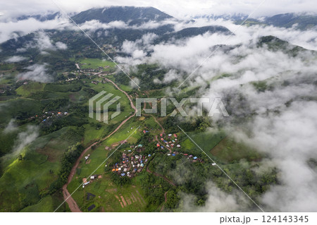 Landscape of Morning Mist with Mountain Layer. mountain ridge and clouds in rural jungle bush forest 124143345