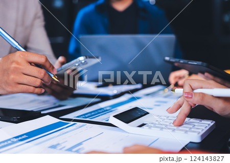 Business Team Analyzing Financial Data in Modern Office 124143827