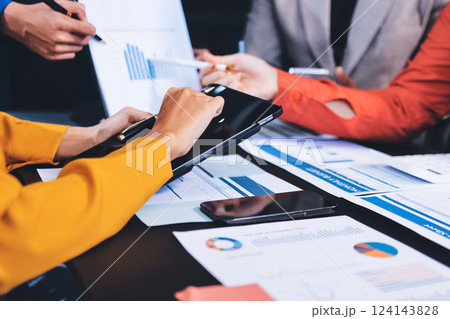 Business Team Analyzing Financial Data in Modern Office 124143828
