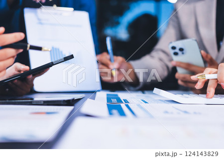 Business Team Analyzing Financial Data in Modern Office 124143829