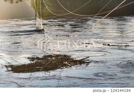 Transmission power lines are touching flood waterheights in river Transmission power lines are touching flood waterheights in river 124144184