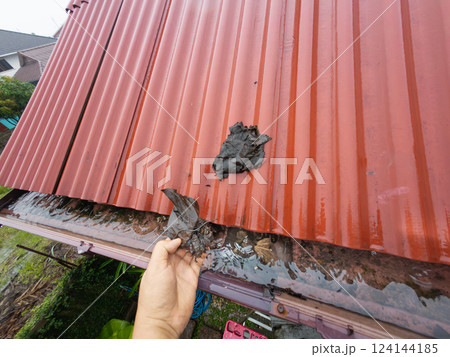 Clogged rain gutter, dirty roof gutter, with wet fallen leaves. Clogged rain gutter, dirty roof gutter, with wet fallen leaves. 124144185