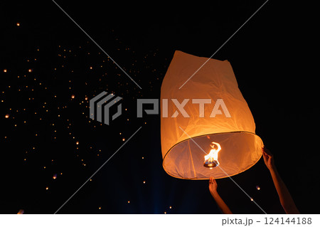Tourist floating sky lanterns in Loy Krathong festival , Chiang Mai ,Thailand. 124144188