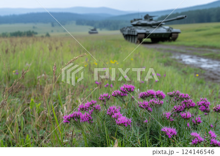blurred tanks in the field with purple flowers 124146546