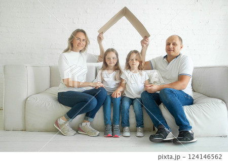 Family together. Housing, relocation, real estate and insurance concept Family together. Housing, relocation, real estate and insurance concept 124146562