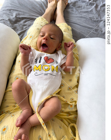 Cute Baby Yawning in I Love Mom Onesie Cute Baby Yawning in I Love Mom Onesie 124147353