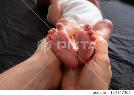 Tender Moment: Holding Newborn Baby Feet Tender Moment: Holding Newborn Baby Feet 124147360