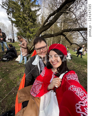 Couple in Traditional Embroidered Clothing Outdoors Couple in Traditional Embroidered Clothing Outdoors 124147385