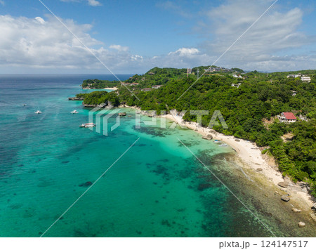 Drone view of clear waters and Hagdan Beach with white sands and rocks. Boracay, Philippines. 124147517